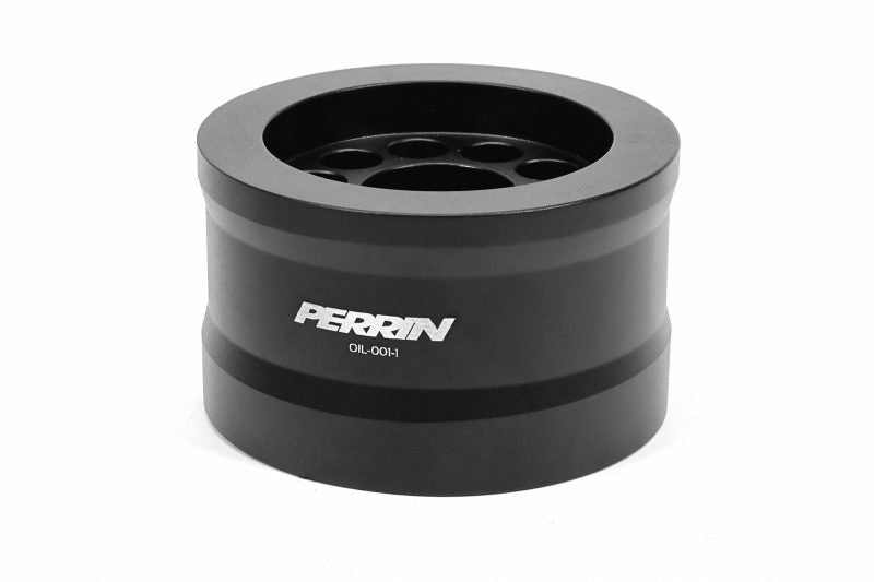 Perrin oil temperature and pressure adapter in black aluminum with multiple openings for sensor installation.