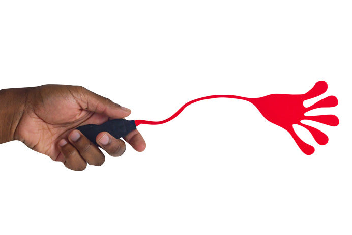 Hand holding a red and black sticky hand on a white background
