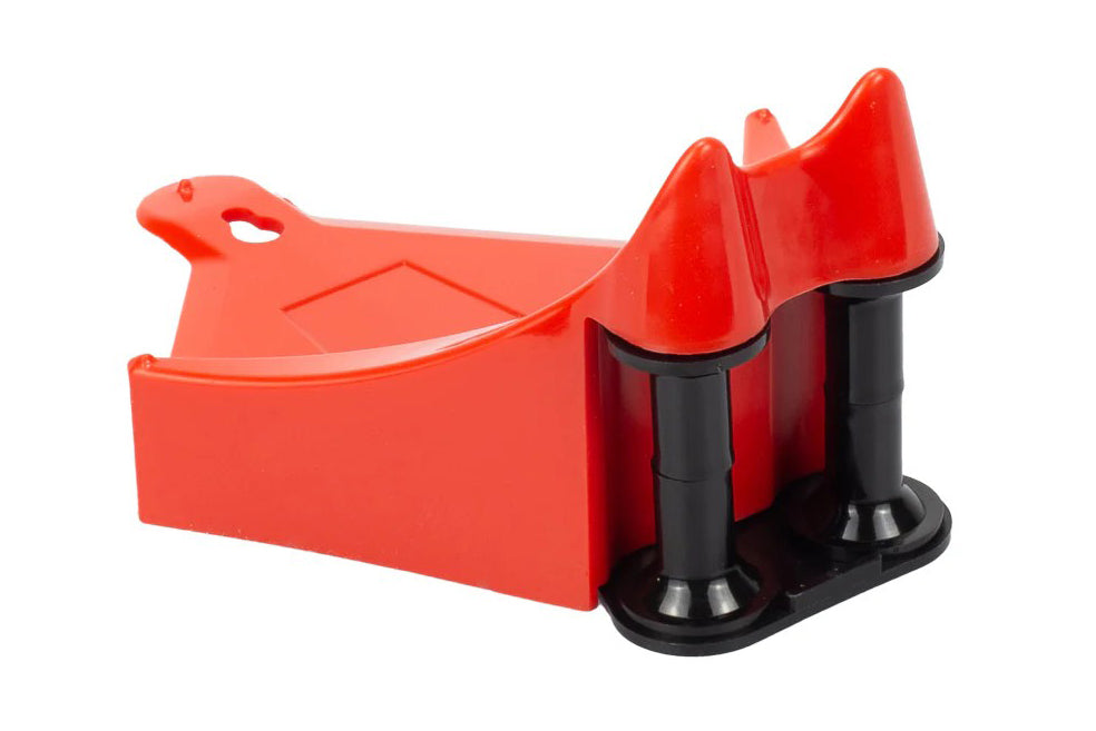 Red and black plastic tool on a white background