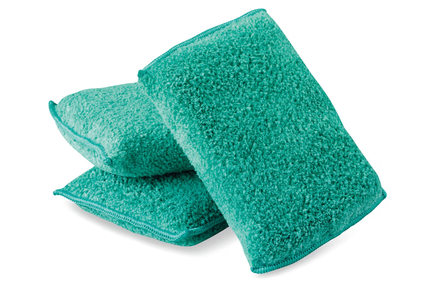 Three green scrubbies on a white background