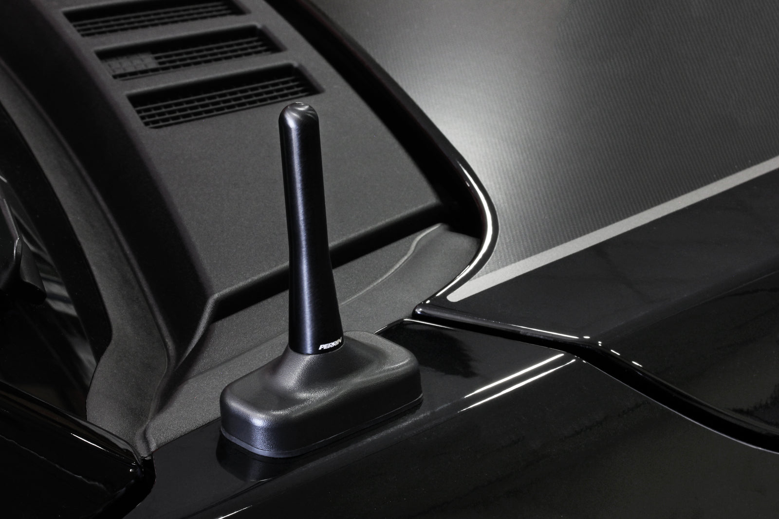 Sleek black antenna designed for Raptor vehicles, enhancing style and functionality on the vehicle's exterior.