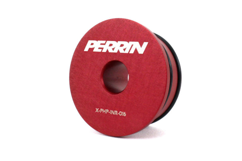 Red solid shifter bushing for Honda vehicles, featuring a central hole and Perrin branding for enhanced performance.