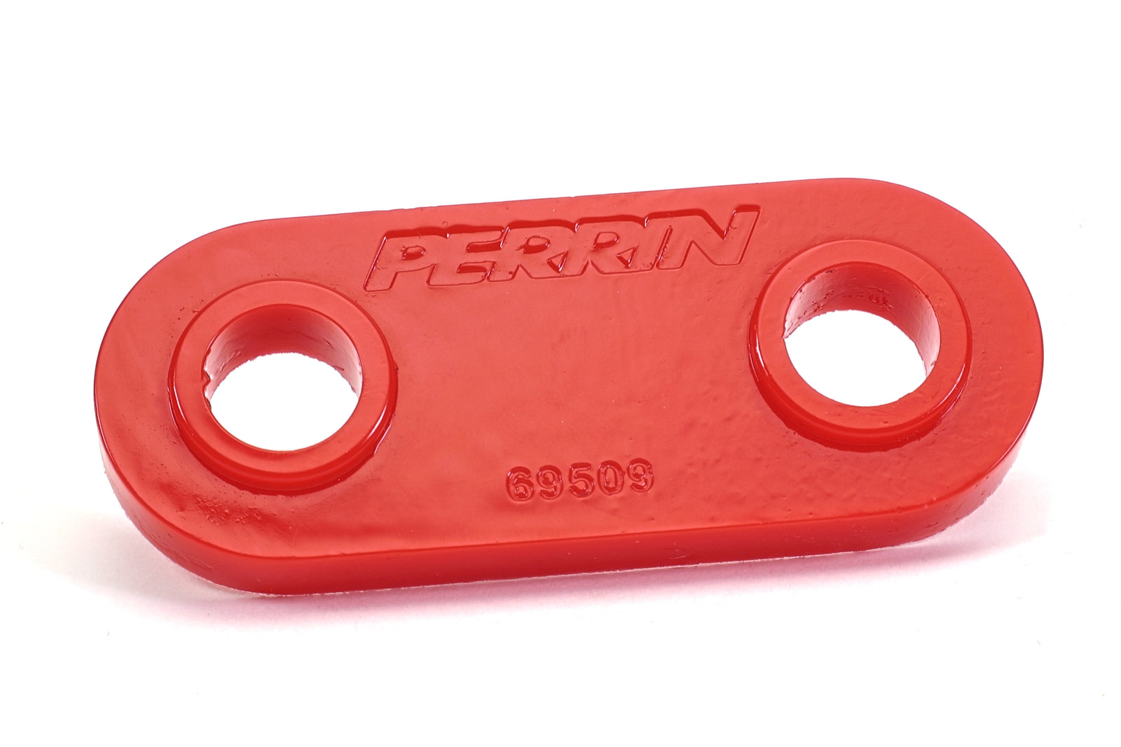 Red transmission crossmember bushing for 2002-2007 Subaru WRX, STI, Forester, Outback, XT, Legacy, and Impreza.