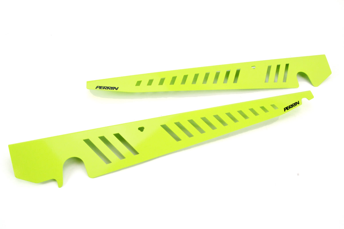 Fender shrouds for 2015-2021 WRX/STI in vibrant green, designed for enhanced performance and style.