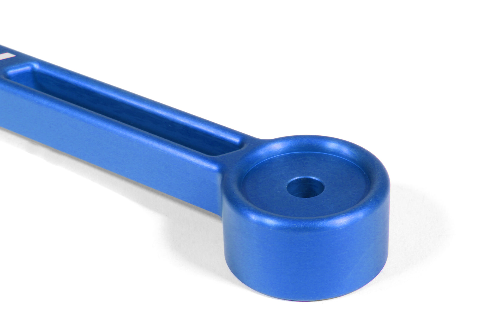 Blue aluminum battery tie down designed for secure battery mounting in performance vehicles.