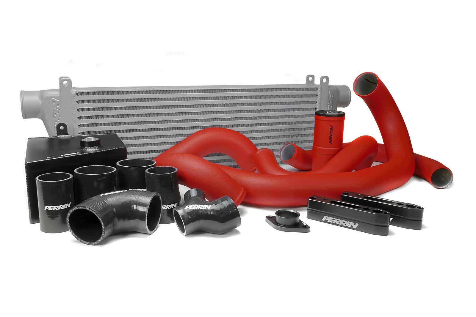 Front mount intercooler kit for 2015-2021 WRX featuring red silicone hoses and black aluminum components.