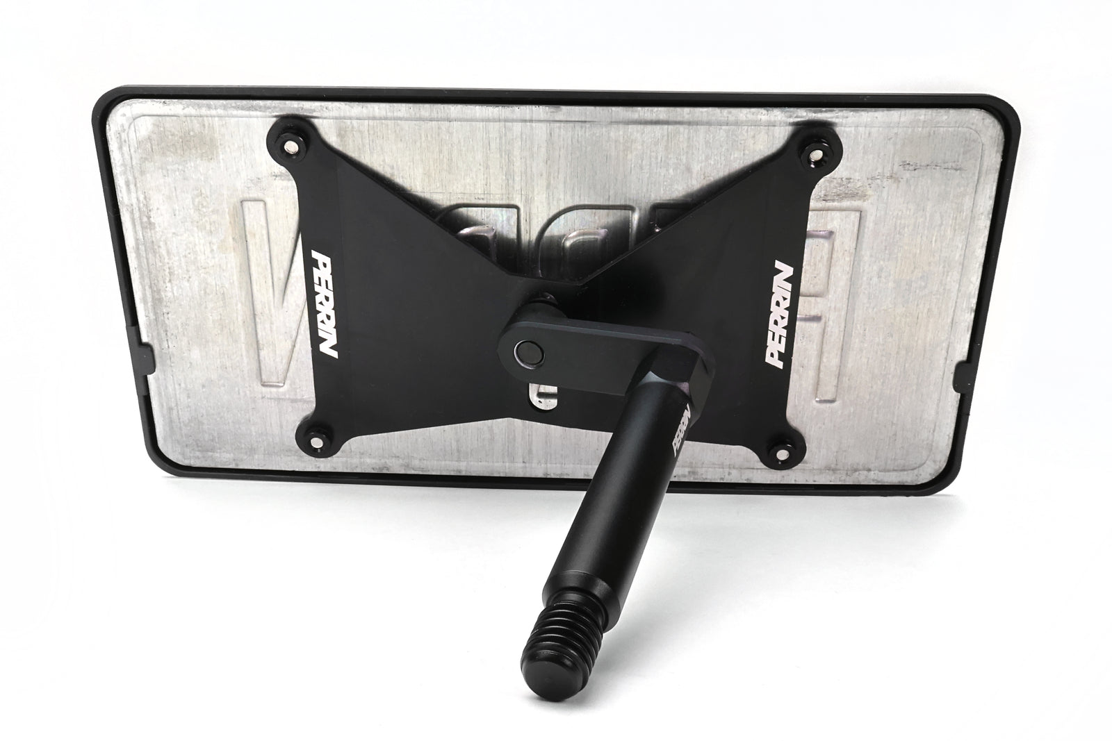 Close-up view of PERRIN license plate relocation hardware and mounting components for GR Corolla installation.