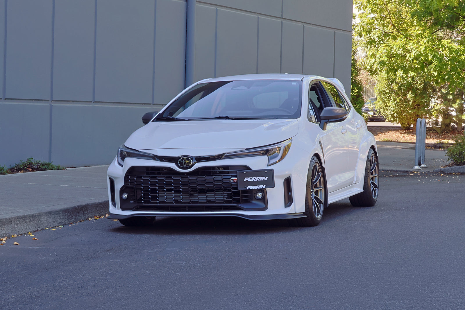 PERRIN License Plate Relocation installation showing mounting stem attached to 2025-2026 GR Corolla tow hook location."