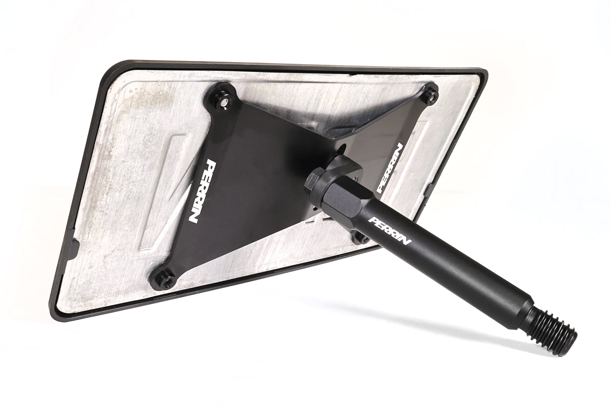 PERRIN front license plate relocation bracket for Toyota GR Corolla shown in black powder-coated finish.