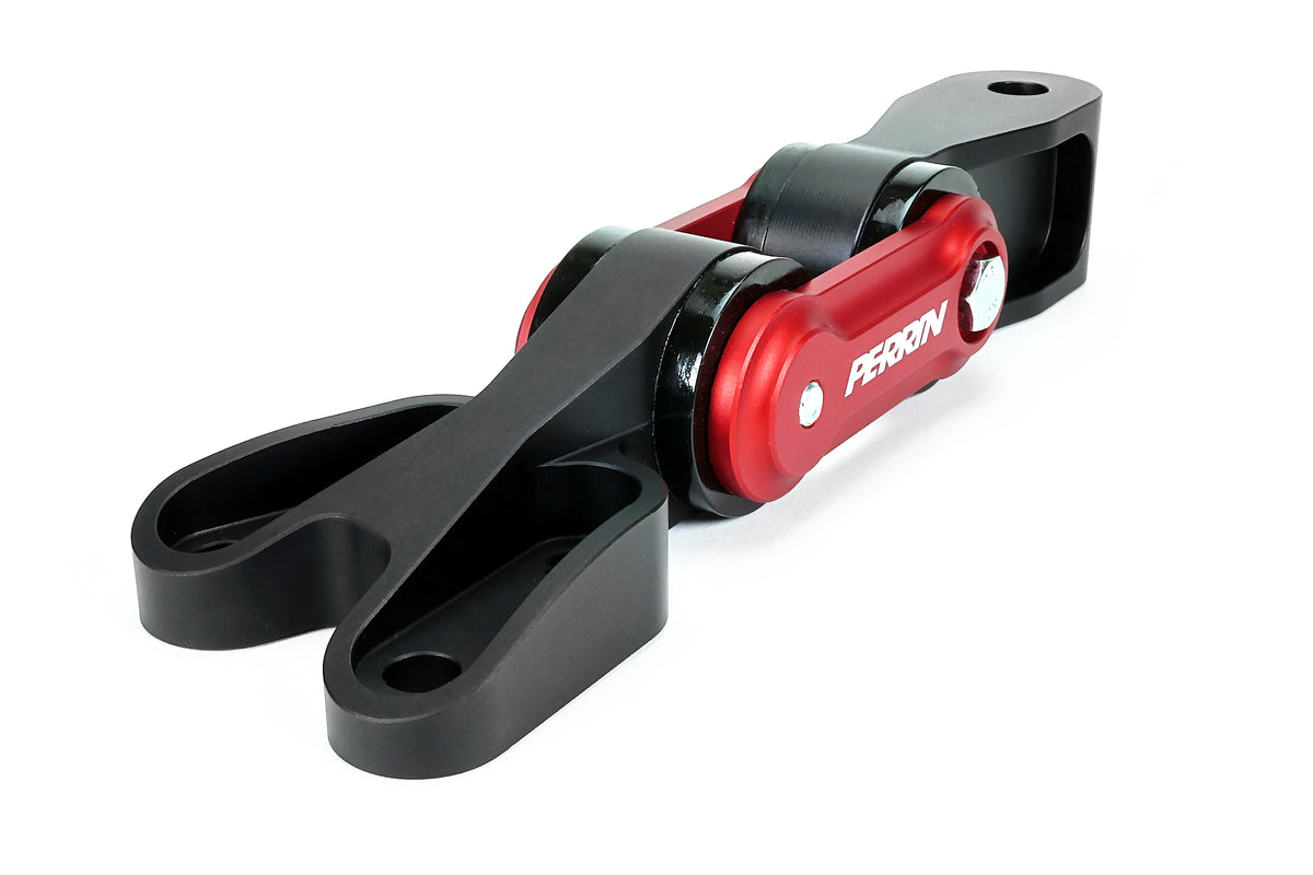 PERRIN Pitch Stop Mount for GR Corolla in black and red, elevated view of forked end mounting holes and bushings