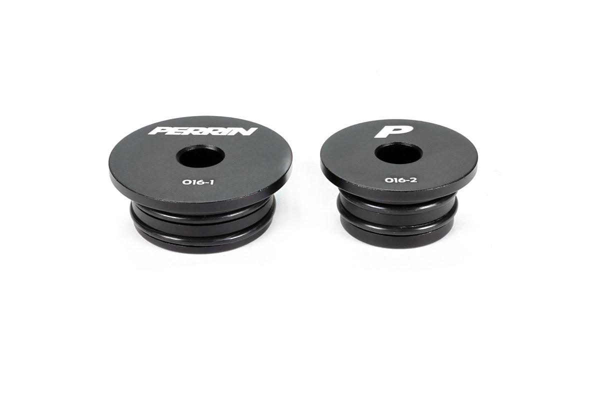 PERRIN GR Corolla Shifter Cable Bushing set on white background, two black anodized aluminum bushings with engraved PERRIN logo and individual part numbers.