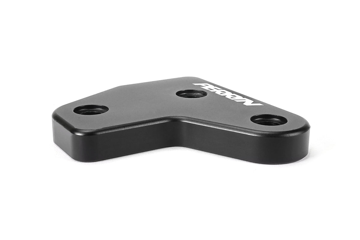 PERRIN GR Corolla Shifter Cable Bracket Lockdown with a black anodized finish and white logo on a white background.