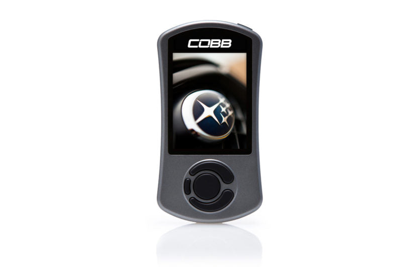 Cobb AccessPORT device with a screen displaying the COBB logo and a Subaru emblem in the background.