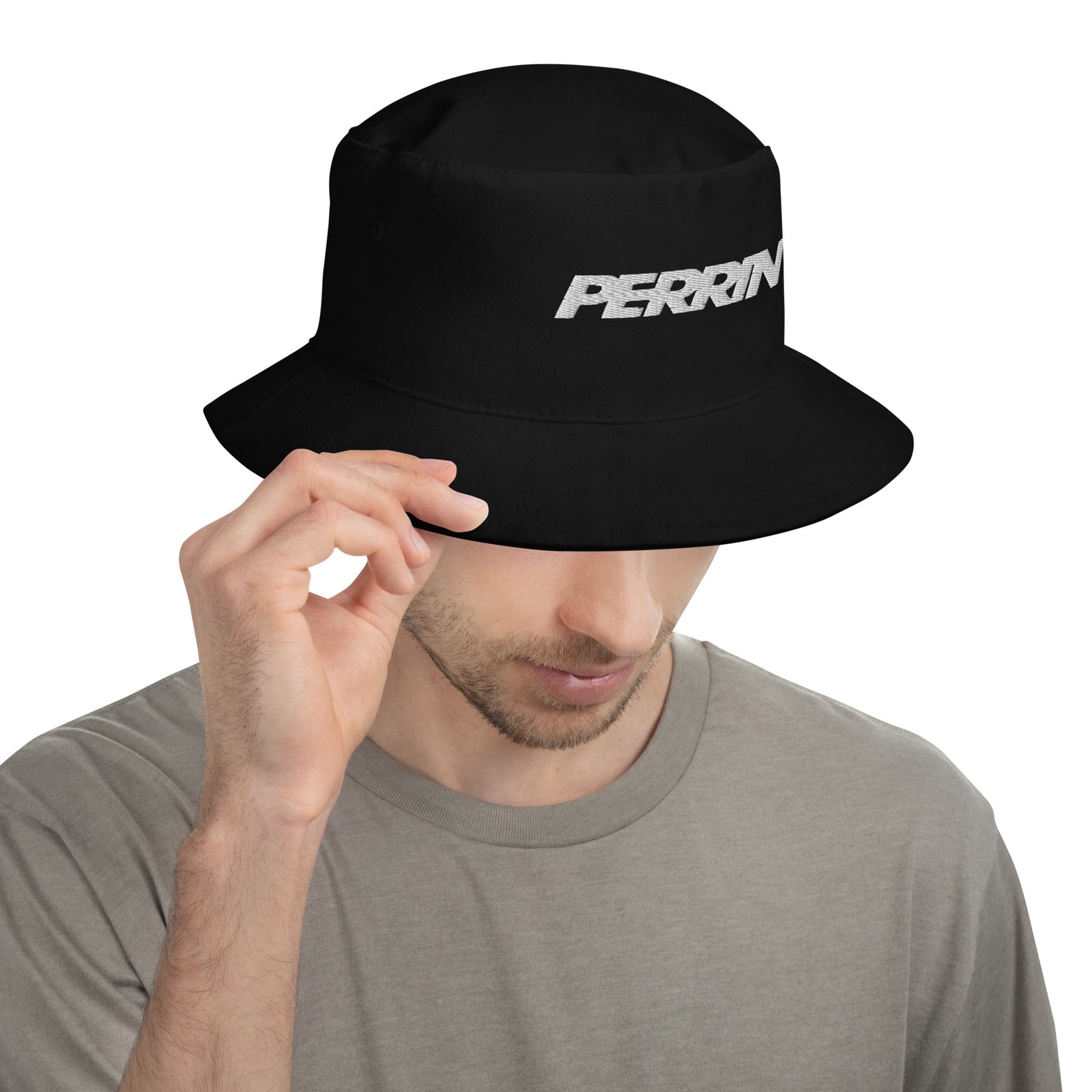 Black bucket hat featuring the Perrin logo, worn by a person in a casual setting.