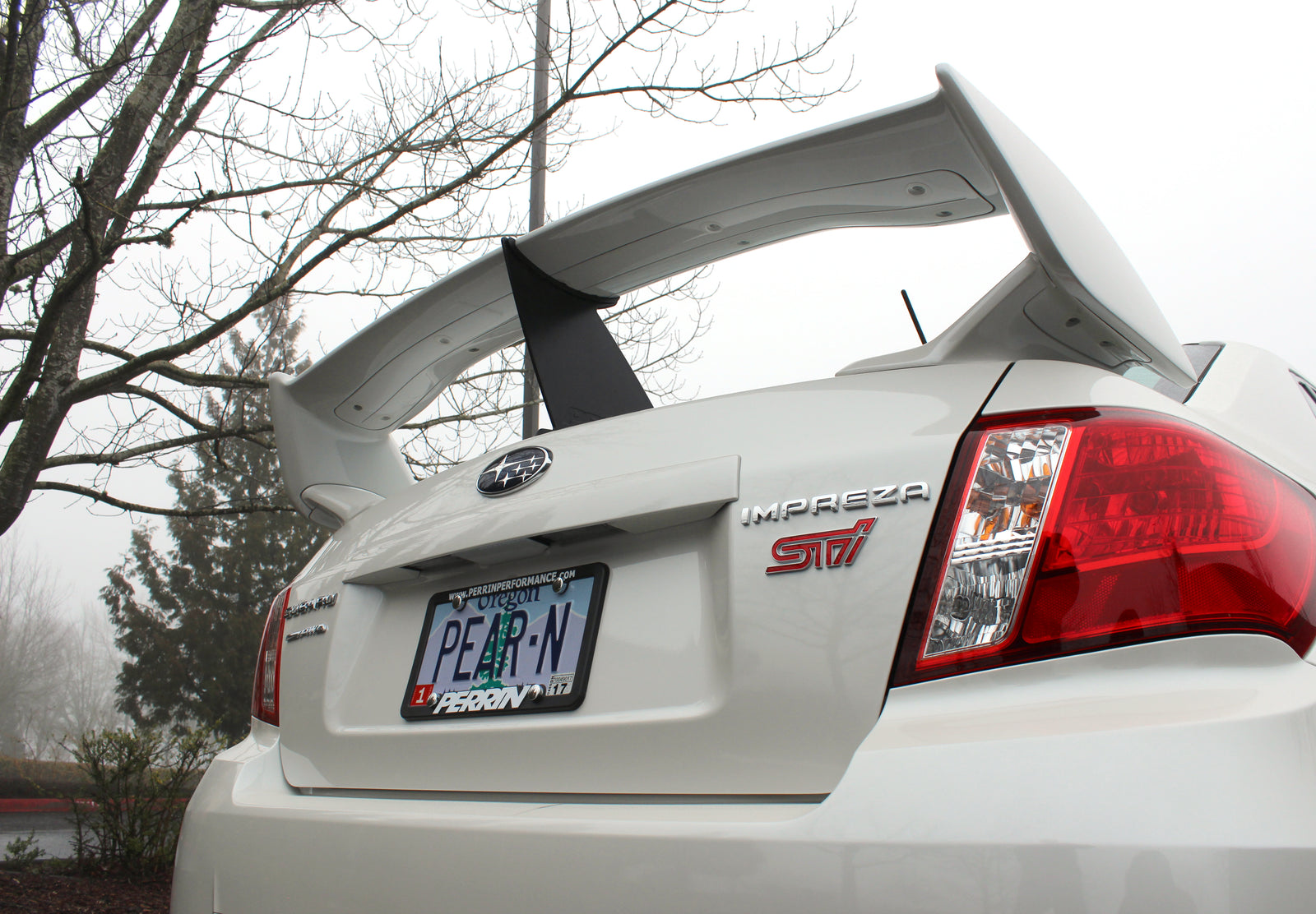 Wing stabilizer for 2011-2014 STI Sedan enhances aerodynamics and stability for performance driving.