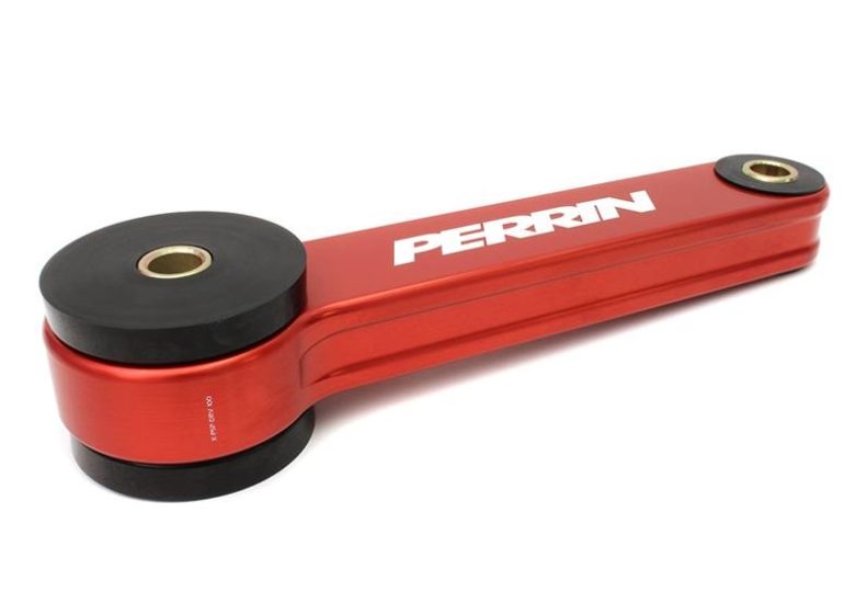 Red aluminum Pitch Stop Mount for Subaru WRX/STI, Impreza, Legacy, Outback, and Crosstrek with black rubber bushings.