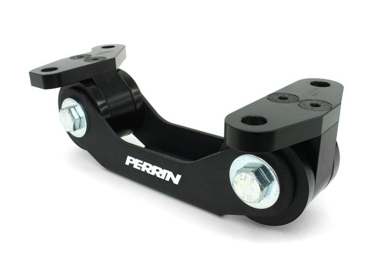 Black transmission mount for manual vehicles, featuring durable construction and bolted design for stability.