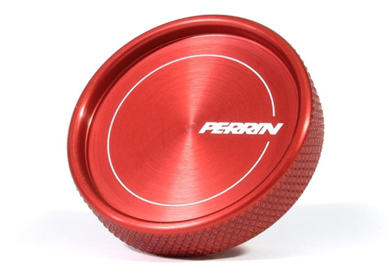 Red aluminum oil fill cap with a textured grip and Perrin logo, designed for automotive use.