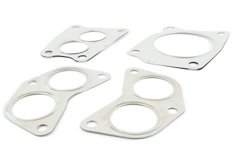 Header gasket kit for FA engines featuring multiple gaskets with circular cutouts and mounting holes for secure installation.