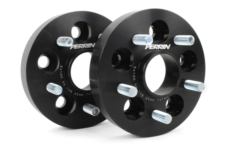 Black 25mm Toyota wheel spacers with multiple bolt holes and silver studs, designed to enhance vehicle stability and aesthetics.