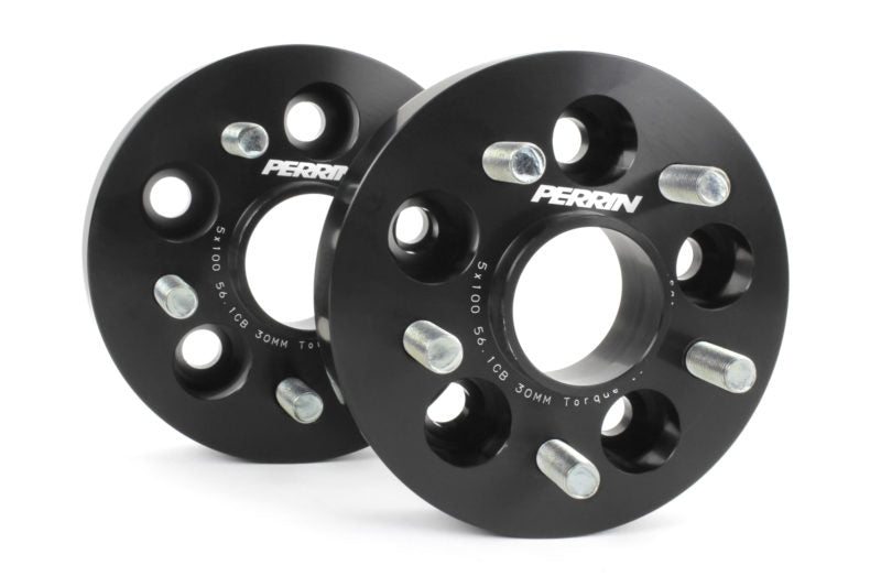 30mm Subaru wheel spacers by Perrin, featuring a black finish and multiple bolt holes for enhanced wheel fitment.