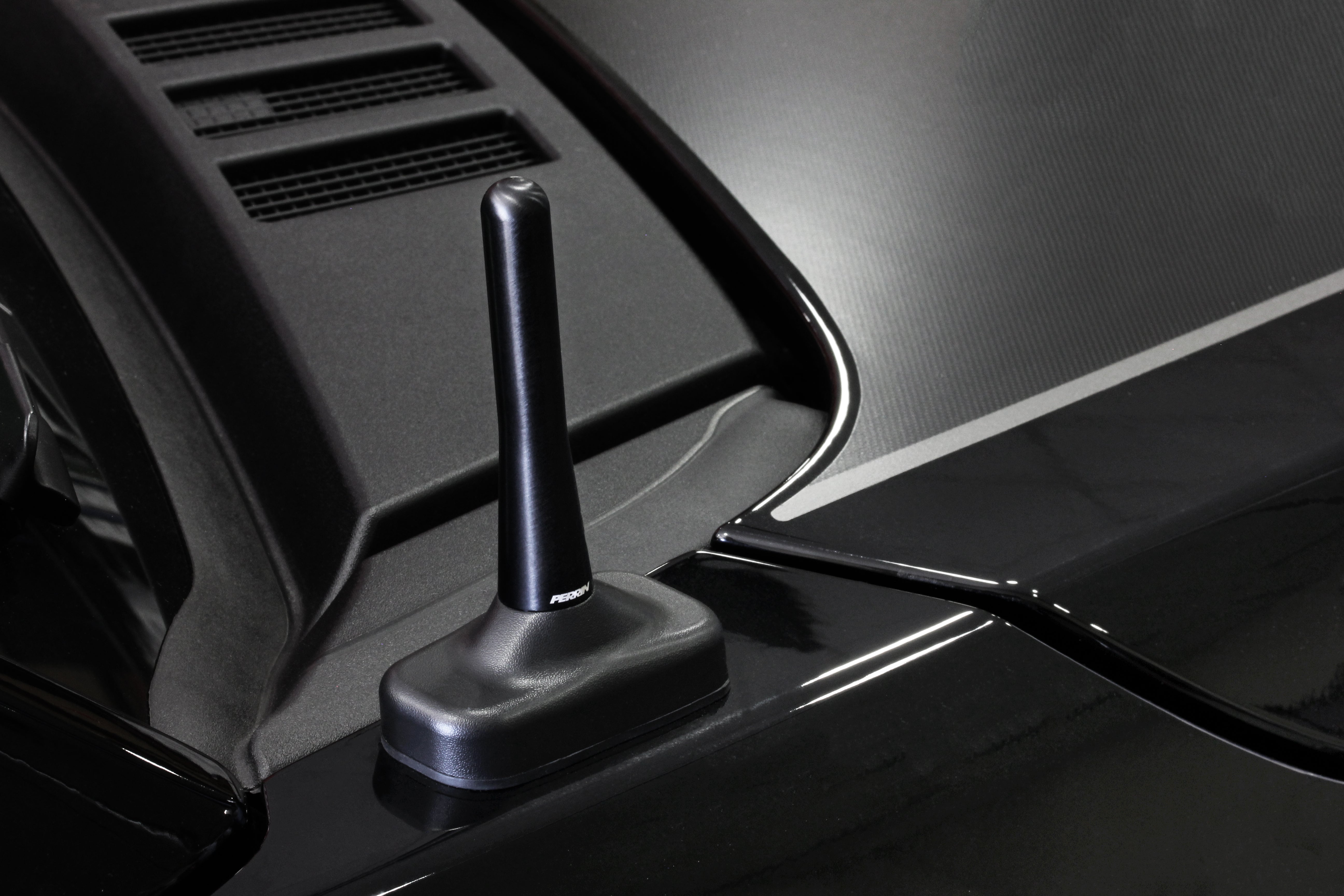 Sleek black antenna designed for Raptor vehicles, enhancing style and functionality on the vehicle's exterior.