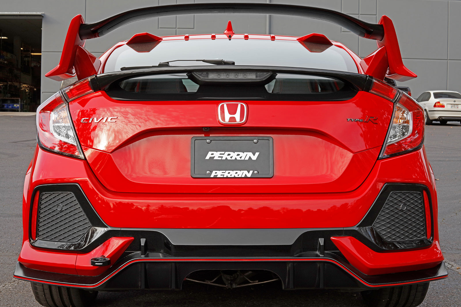 Rear view of a red Honda Civic Type R showcasing the Perrin Tow Hook, designed for 2017-2021 Civic SI and Type R models.