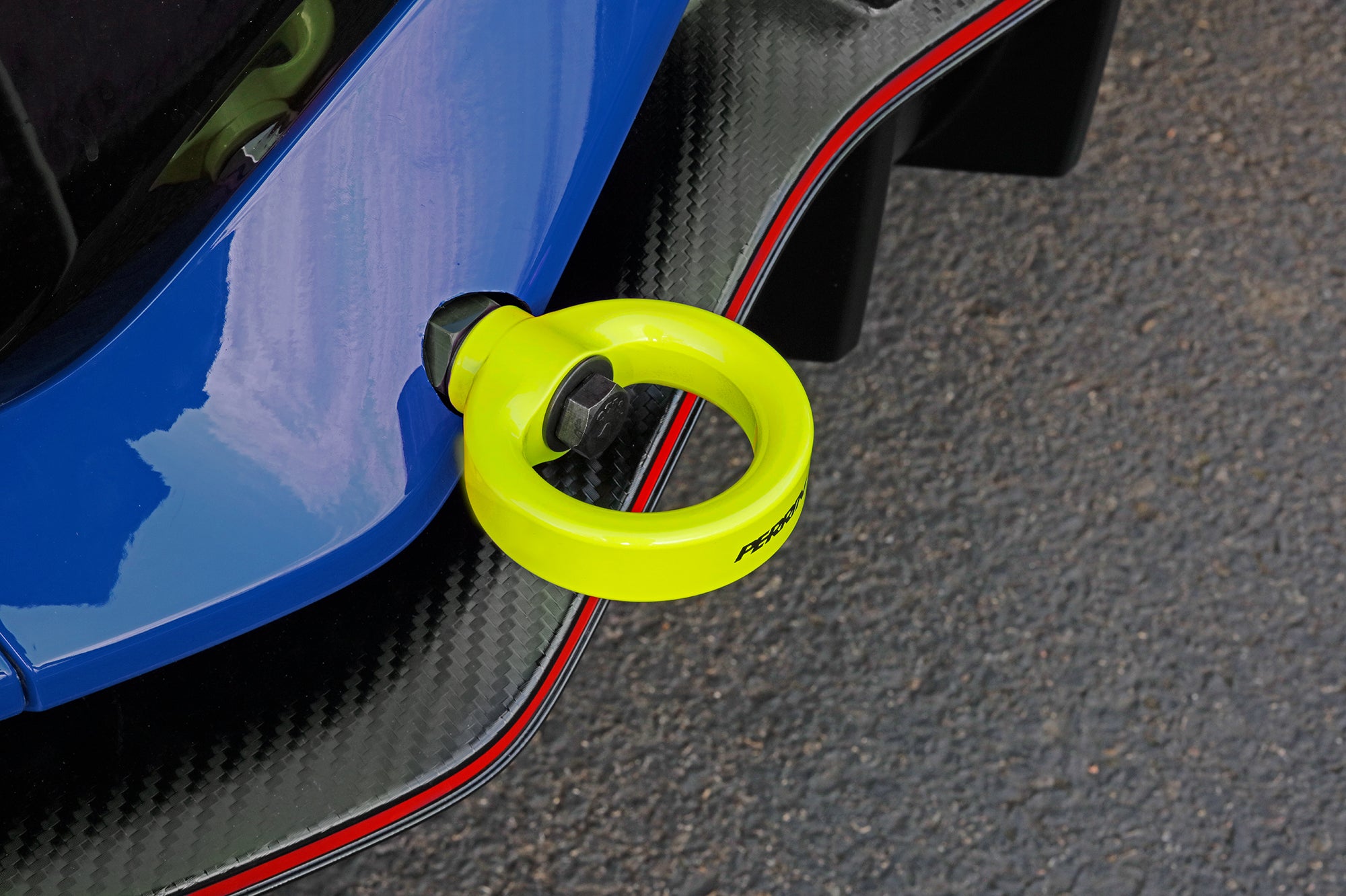 Bright yellow rear tow hook designed for 2017-2021 Civic SI and Civic Type R hatchbacks, enhancing performance and style.