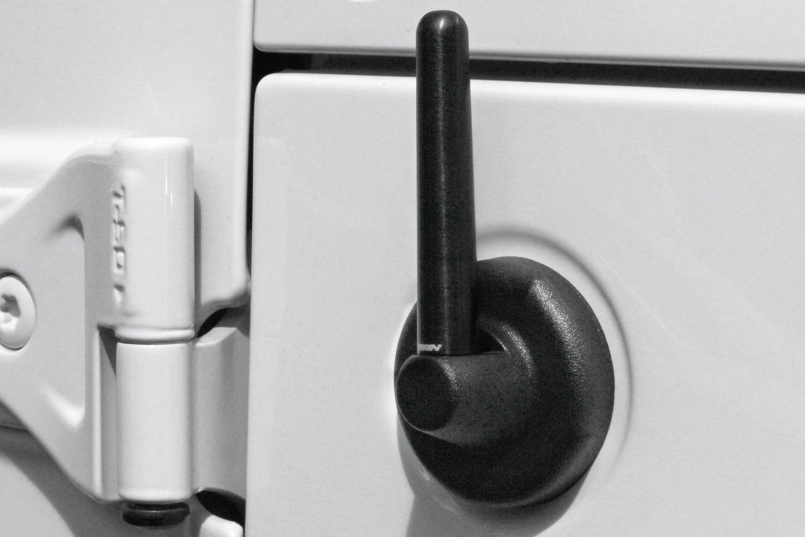 Antenna mounted on a Jeep, designed for improved signal reception and sleek appearance. Ideal for off-road enthusiasts.