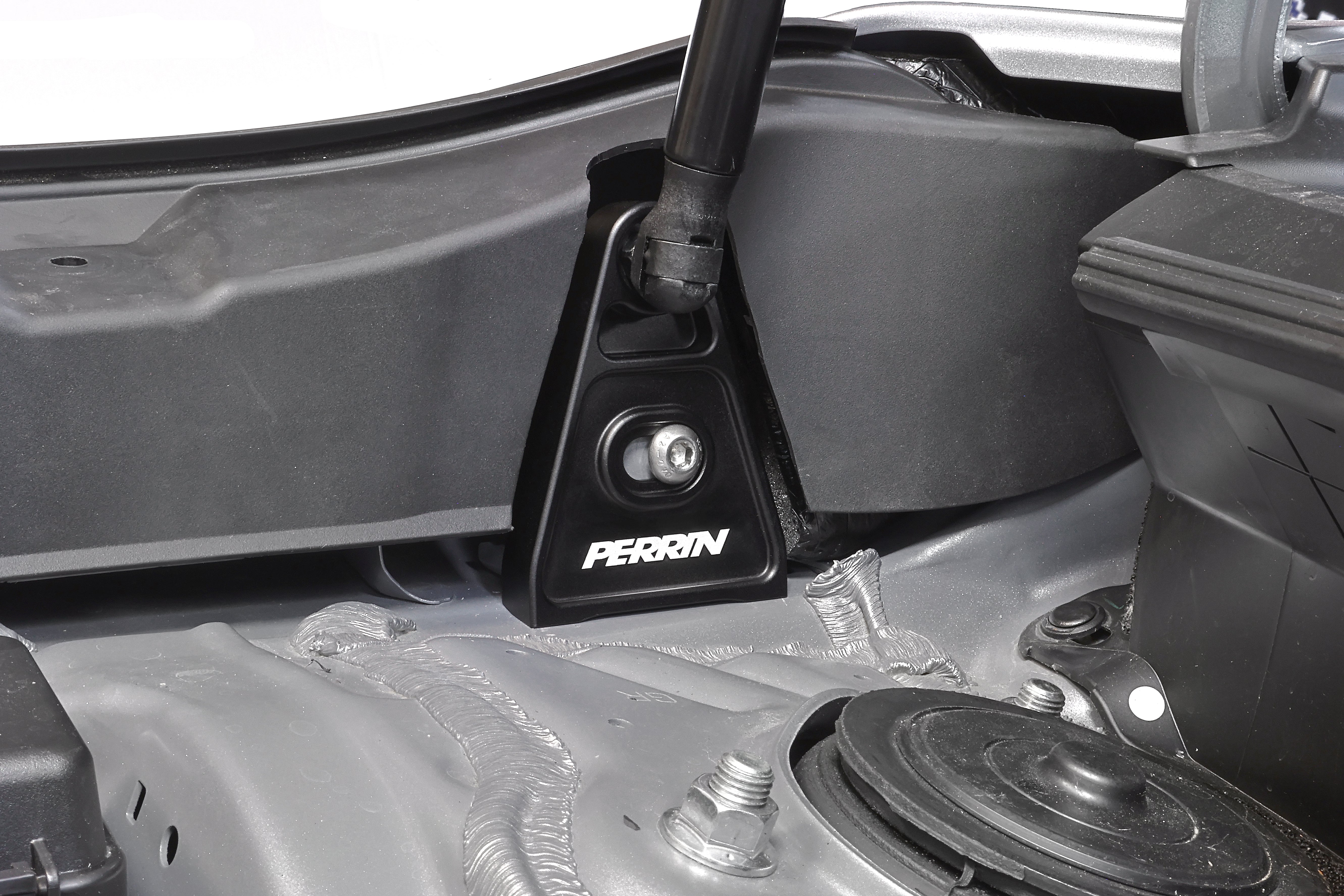PERRIN High-Lift Hod Brackets installed on a Subaru.