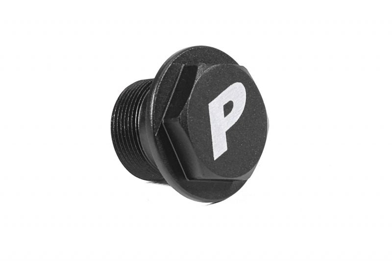 Black clutch delay valve delete plug with a hexagonal shape and a prominent "P" logo on the top.