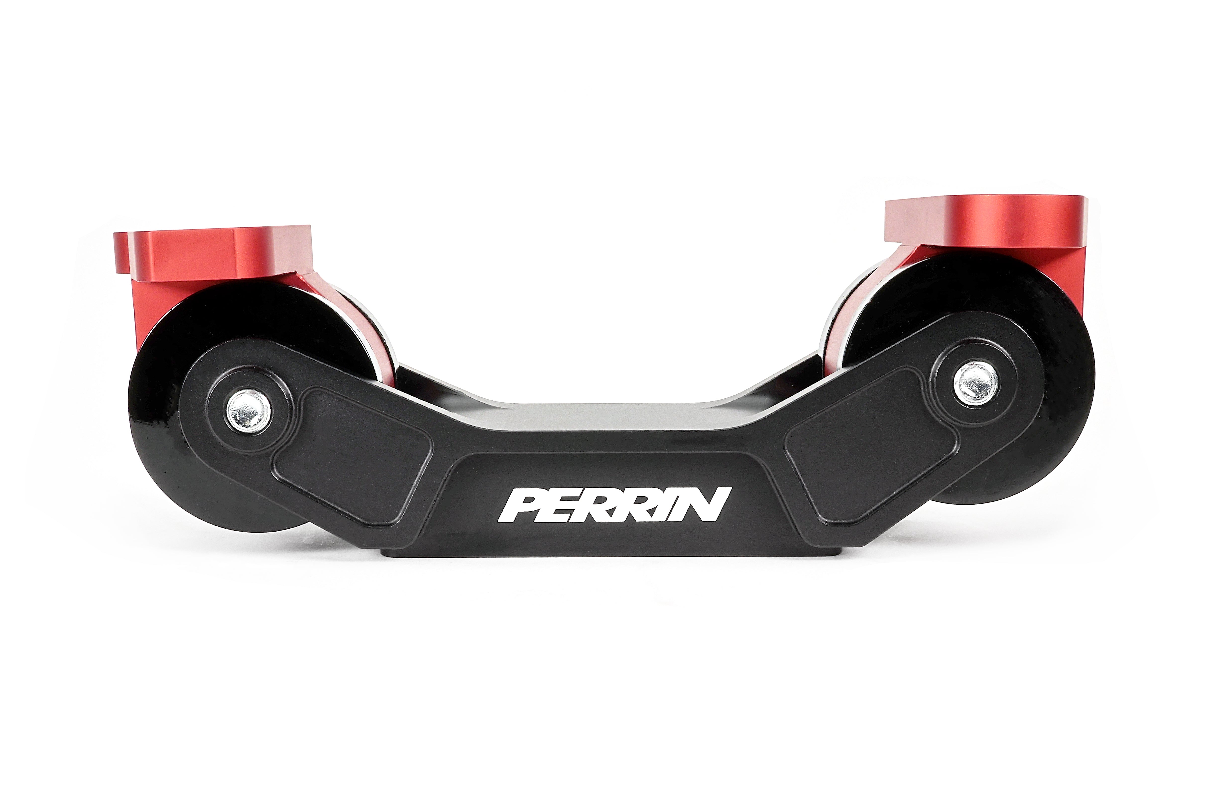 PERRIN Transmission Mount in black billet aluminum with red anodized mounting bases and black bushings