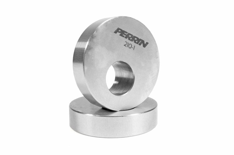 Perrin driveshaft carrier bushings, featuring a smooth metallic finish and a central hole for installation.