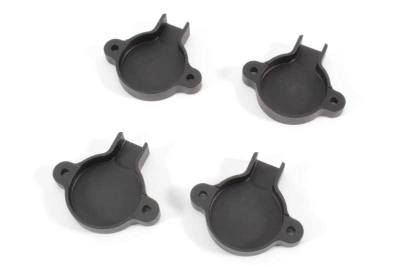Set of four black cam solenoid covers designed for WRX models, featuring a circular shape and mounting tabs.