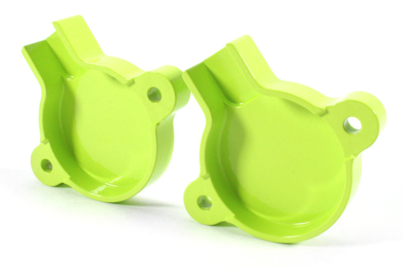 Bright green cam solenoid covers designed for WRX engines, featuring a smooth finish and precise cutouts for installation.