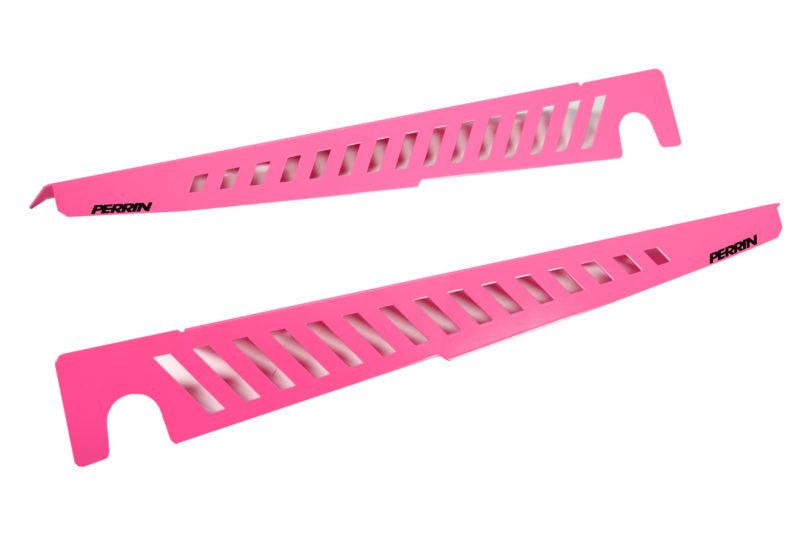 Perrin pink Fender Shrouds with cut-out designs, designed to enhance vehicle aesthetics and performance.