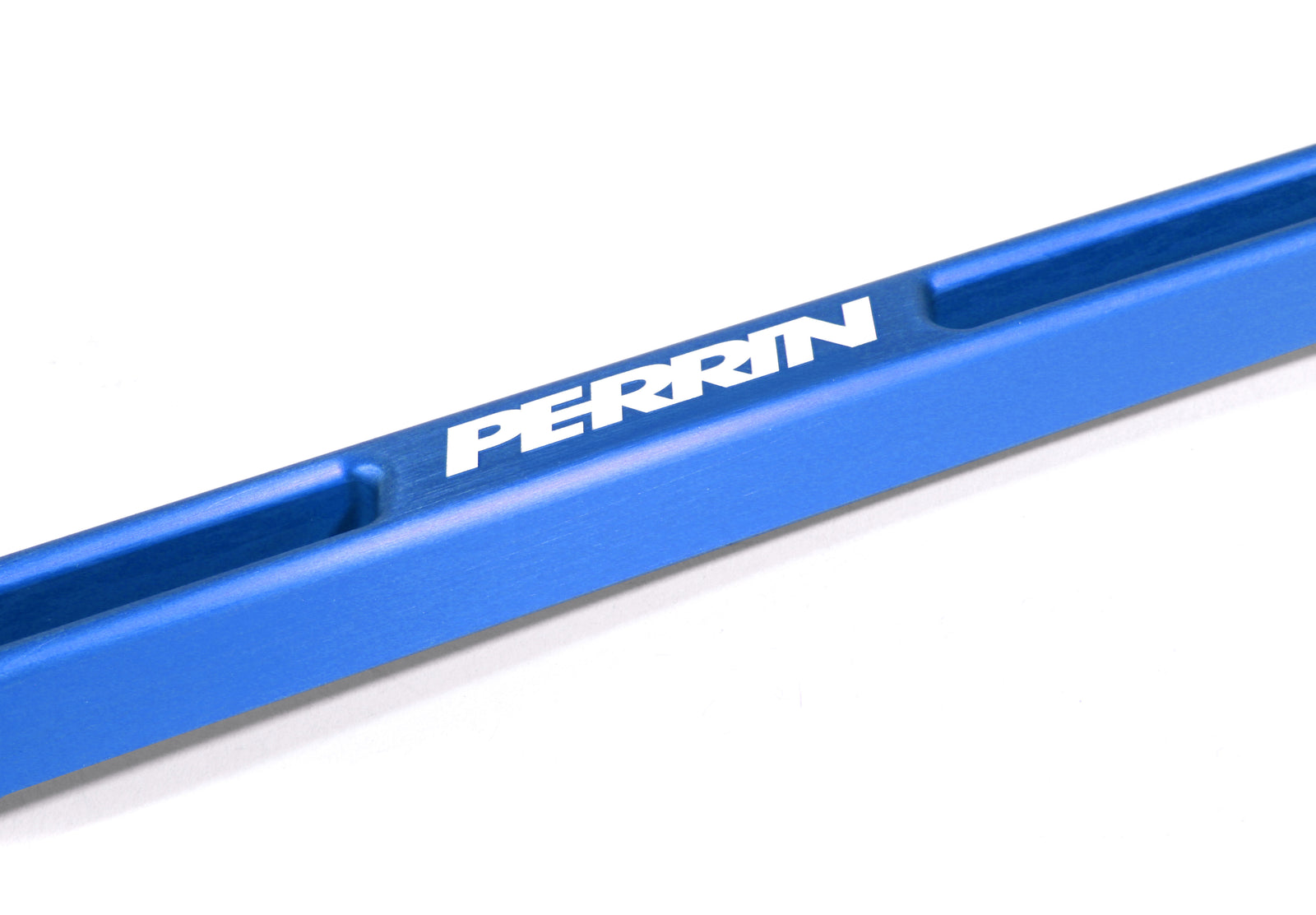 Aluminum battery tie down in blue with PERRIN branding, designed for secure battery mounting in performance vehicles.