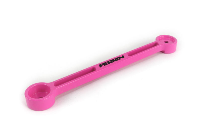 Perrin pink battery tie down designed for secure battery mounting in vehicles. Lightweight and durable construction.