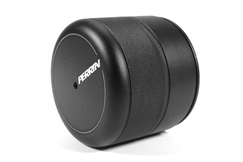Black oil filter cover with a textured finish and Perrin branding, designed for automotive use.