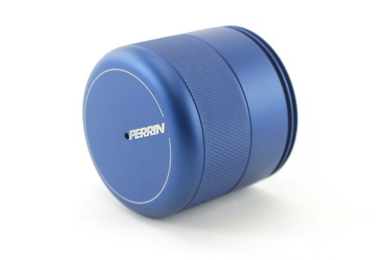 Blue oil filter cover with a textured grip and Perrin logo, designed for enhanced engine performance and durability.