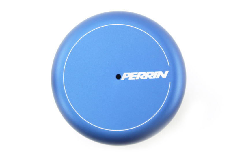 Blue oil filter cover with a smooth finish and a central hole, featuring the Perrin logo prominently displayed.