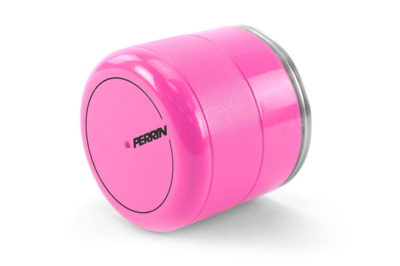 Bright pink oil filter cover with a textured grip and Perrin branding, designed for automotive use.