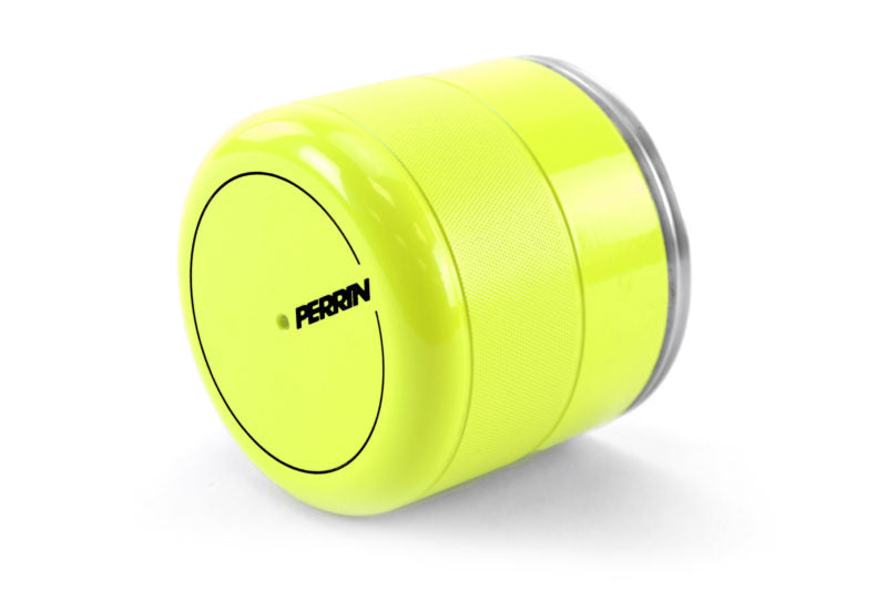 Bright yellow oil filter cover with a textured grip and Perrin branding, designed for enhanced engine protection.