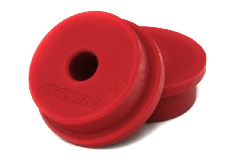 Red shifter linkage bushings designed for enhanced performance and durability in automotive applications.