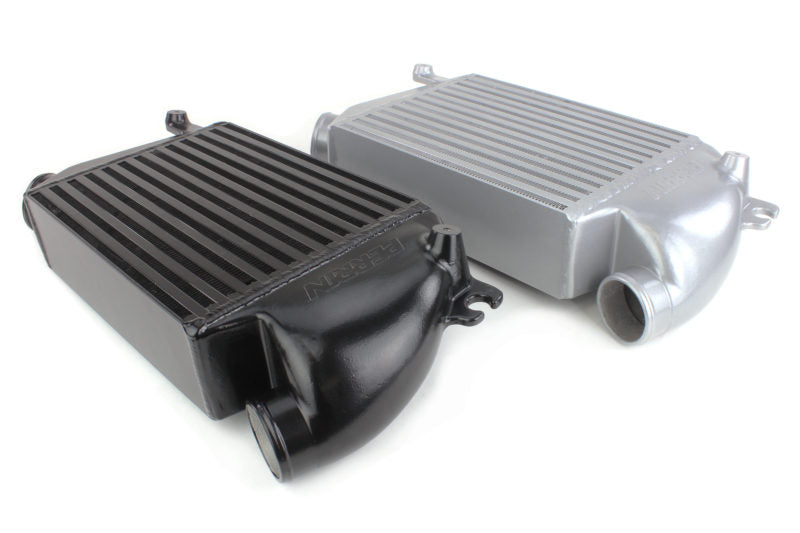 Top mount intercooler for 2015-2021 WRX, featuring a sleek design in black and silver finishes for enhanced performance.