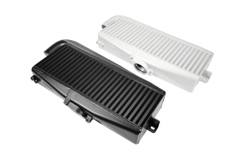 Top mount intercooler for 2022-2025 WRX, featuring a sleek black and white design with ribbed surfaces for optimal airflow.