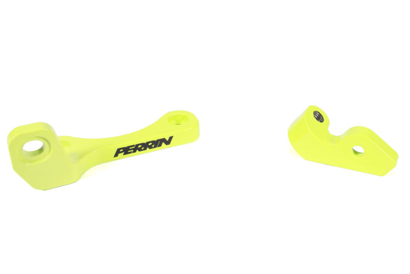 Bright yellow top mount intercooler bracket set with Perrin branding, designed for secure intercooler installation.