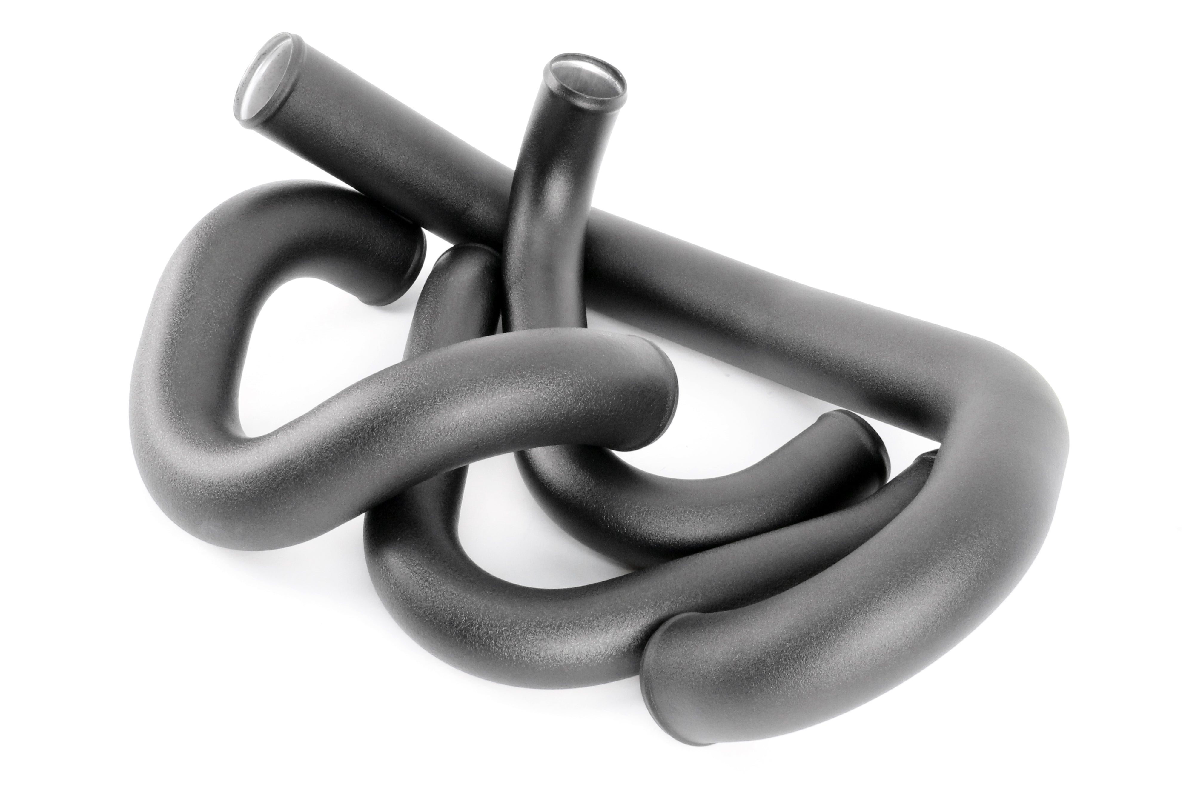 Front mount intercooler kit components for 2015-2021 WRX, featuring black silicone hoses with a smooth finish.