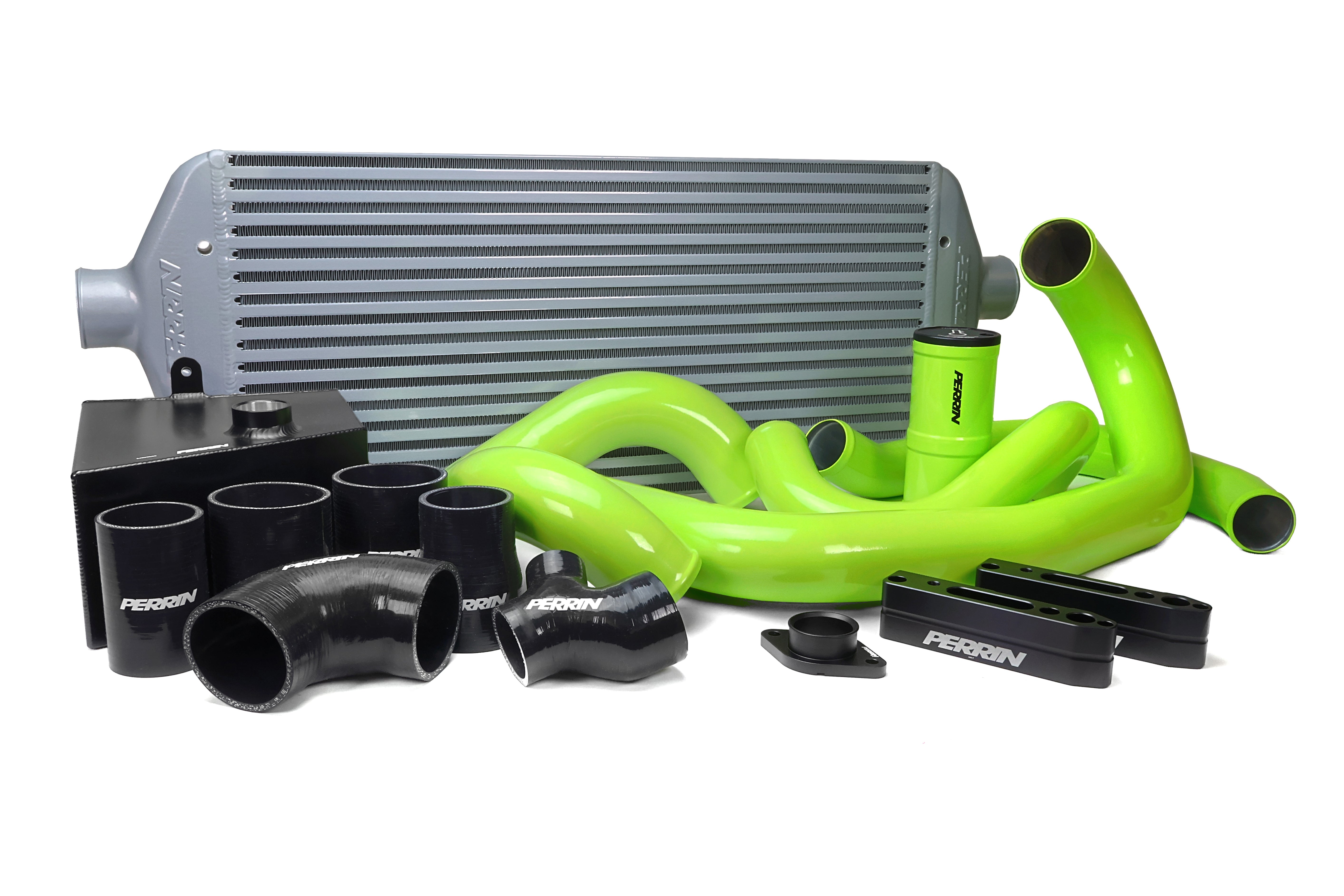 Front mount intercooler kit for 2015-2021 WRX featuring a large core, piping, and silicone hoses in vibrant green and black.