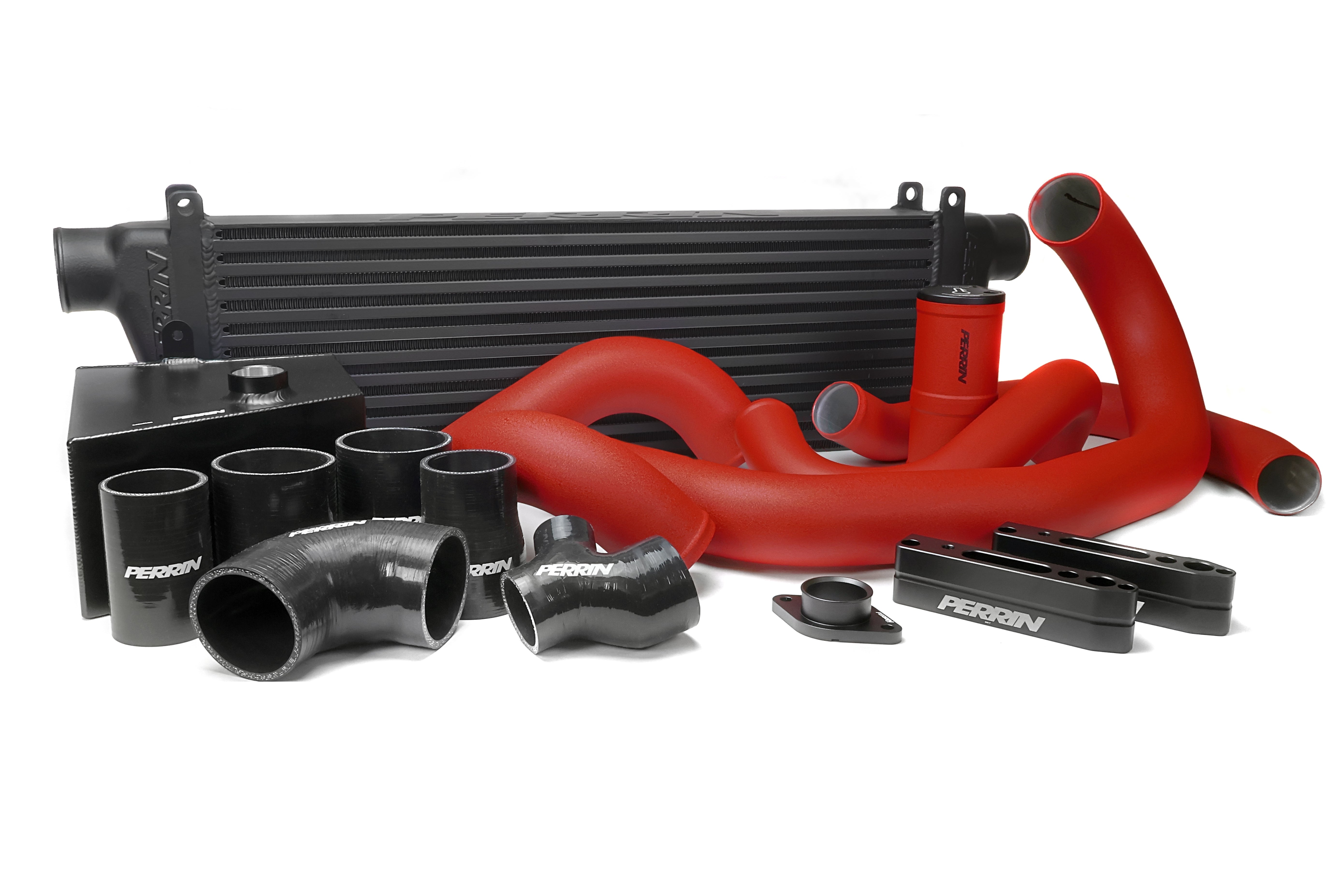 Front mount intercooler kit for 2015-2021 WRX featuring red silicone hoses and black aluminum components.